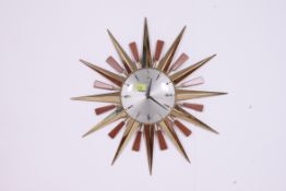 A good 1970's retro sunburst wall clock having silvered dial by Metamec.