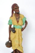 A large mid 20th century floor standing Carnival / fairground ware chalkware of an Arab / Turkish
