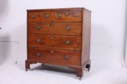 A Georgian mahogany inlaid 2 over 3 chest of drawers raised on bracket feet having a 2 short over 3