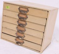 A good mid 20th century metal painted   Industrial metal filing cabinet having chrome hoop handles