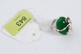 A white metal 925 silver and jade art nouveau style ring with a frog upon.  Weight 13grams.