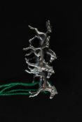 A good white metal (stamped '925' for silver ) brooch depicting three wild horses
