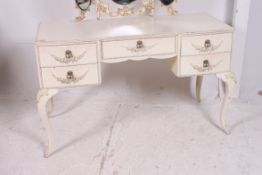 A 20th century Louis style painted shabby chic  rococo dressing table Raised on shaped slender legs
