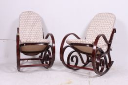 2 20th century Thoney style bentwood rocking chairs / armchairs having caned seats and backrests