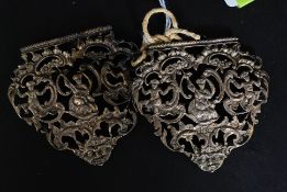 An Edwardian silver belt buckle with green man and cherub pierced decoration. Hallmarked London.