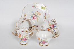 A pretty Royal Stafford 21 Piece bone china tea set with chintzy floral decoration to include cups,