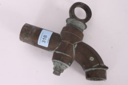 A 17th century / 18th century bronze town water tap of large proportions with swivel mount atop