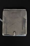 A silver matchbox holder case vesta having hinged top with chased geometric design bearing