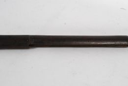 An early, possibly British military issue ( Lee Enfield ) flintlock wooden rifle barrel housing.