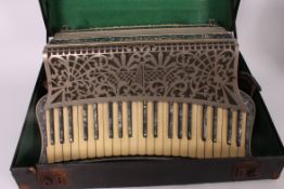 A Scandelli Scott Wood Four Accordion complete with the case- simulated blue marble /