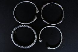 A collection of 4x white metal and silver ladies jewellery bangles,