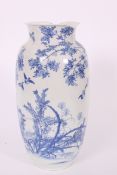 A large 19th century Kang-Xi blue and white vase of heavy porcelain stylised in blue and white with