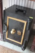 A good early 20th century cast iron safe being ebonised with gilded borders ( unlocked ) however no