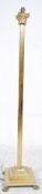 A 20th century antique style good quality brass standard lamp having reeded column raised on