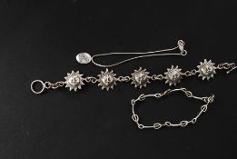 A Siam silver stamped 925 bracelet being chain linked with 5 sun god roundels,
