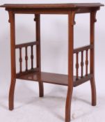 A Victorian Arts & Crafts oak Liberty style side / lamp table having spindle gallery underside with