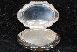 A white metal powder compact,