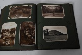 An Edwardian postcard album featuring a range of postcards, mostly topographical.
