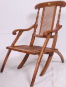 A 19th century folding steamer / campaign chair having collapsing frame with upholstered central