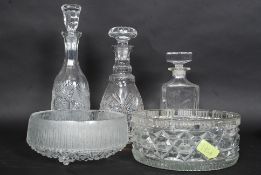 A collection of 3 cut glass drinks decanters complete with the stoppers together with 2 cut glass