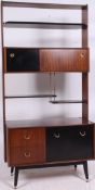 An original 1960's G-Plan Librenza line bookcase room divider in walnut with brass supports and and