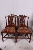 A set of 4 19th century Victorian mahogany Chippendale revival dining chairs being raised on