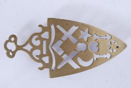 A pierced Victorian brass trivet pierced with masonic symbols