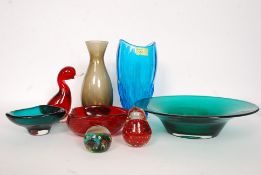 A collection of studio art glass to include fruit bowls, paperweights, control bubble bowl,