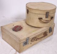 A good 1950's laquered travel suitcase and matching ladies vanity case having Cunard shipping