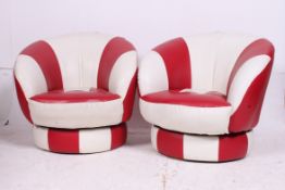 A pair of unusual red and white two tone swivel armchairs upholstered in leather with makers labels
