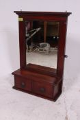 A late 19th century mahogany wall mirror / toilet dressing mirror having shelf with twin drawers to