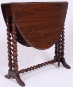 A 19th century Victorian walnut sutherland table raised on bobbin turned legs with the original