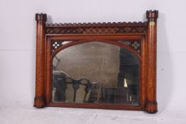 A Victorian birds eye maple castle top overmantel mirror.