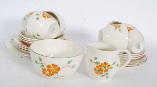 A good George Jones Art Deco chintz pattern part tea service comprising cups,