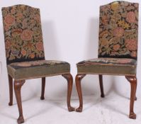 A pair of 18th century Queen Anne walnut dining chairs having overstuffed tapestry upholstered