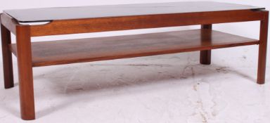 A vintage retro G Plan teak wood oblong coffee table with smoked glass top and a shelf underneath.