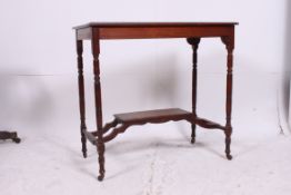 An Edwardian mahogany inlaid lamp / hall table having rectangular top raised on squared supports