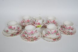 A china part tea service by Rosalyn in the Magnolia pattern