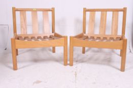 A pair of retro school / Industrial Ercol staff chairs ( lacking cushions ) bearing model no 747.