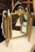 A 1950's gilt finished dressing table triple mirror - tryptych mirror of rococo form