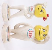 Two vintage style cast iron Esso fuel advertising money boxes / statues.