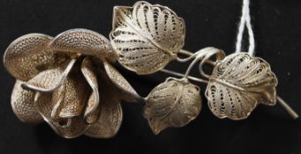 A silver 900 proof marked continental czech filigree worked ladies brooch on the form of rose with