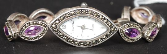 A contemporary silver 925 ladies dress watch with inset amethyst stone bracelet with lozenge shape