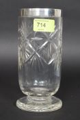 A silver hallmarked rimmed cut glass celery glass of tall form