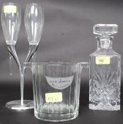 A vintage style Moet Chandon ice bucket along with a Moet Chandon lovers glass set with chrome