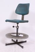 An amazing 1950's machinists industrial stools / chair having oversized metal foot plate with
