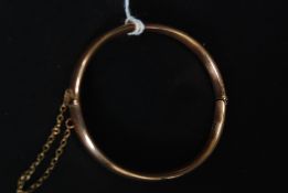 Hallmarked 15 ct gold bracelet bangle with safety chain.