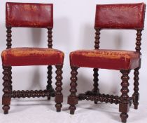 A pair of 19th century red leather Jacobean revival bobbin turned dining chairs.