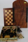A resin chess set, complete, with the chessboard and also a vintage shove ha'penny board.