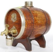 A 1930,s coopered oak sherry barrel with a brass tap and drip bucket.